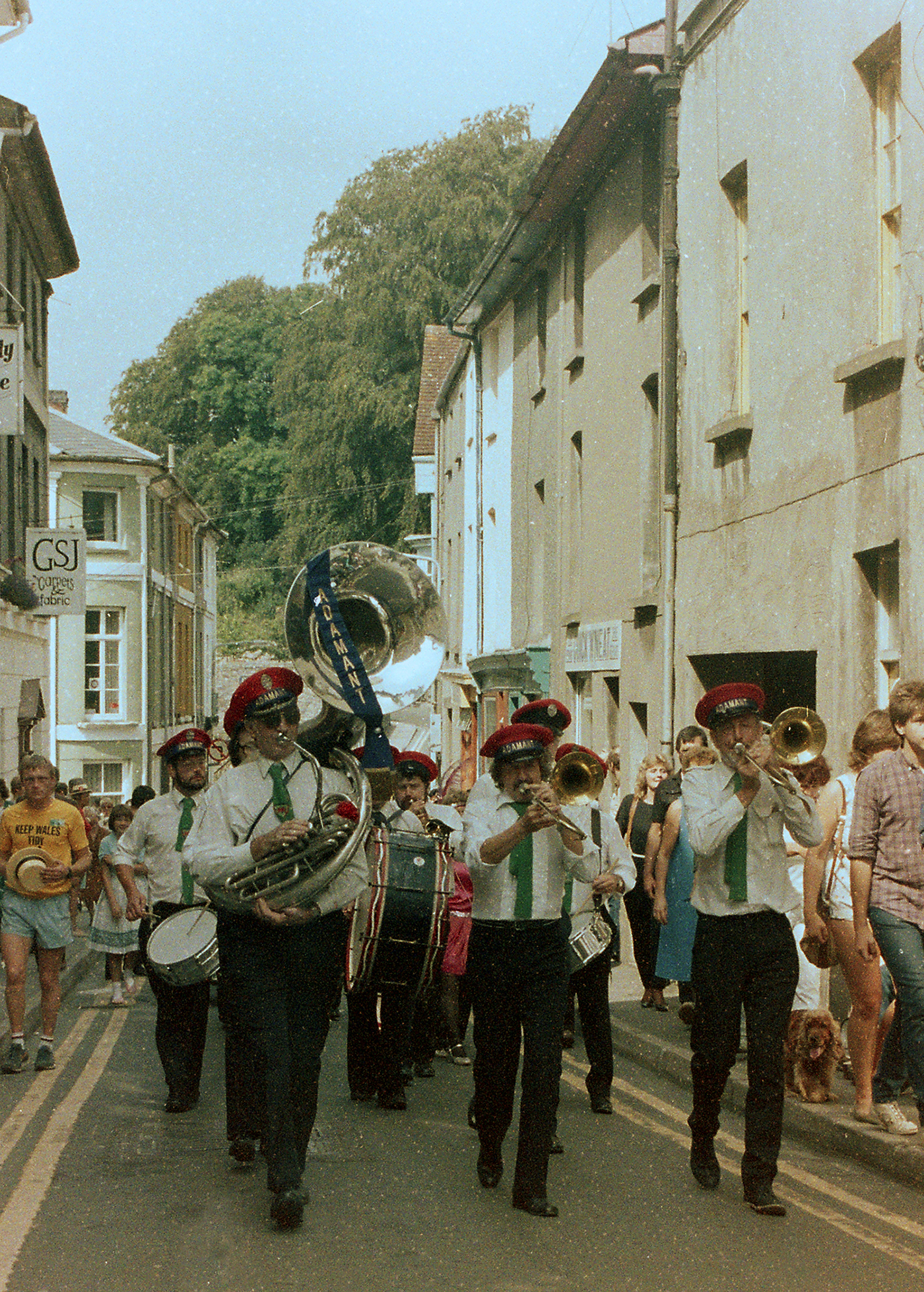 Image of a brass band in smart uniform parading the streets of Brecon 