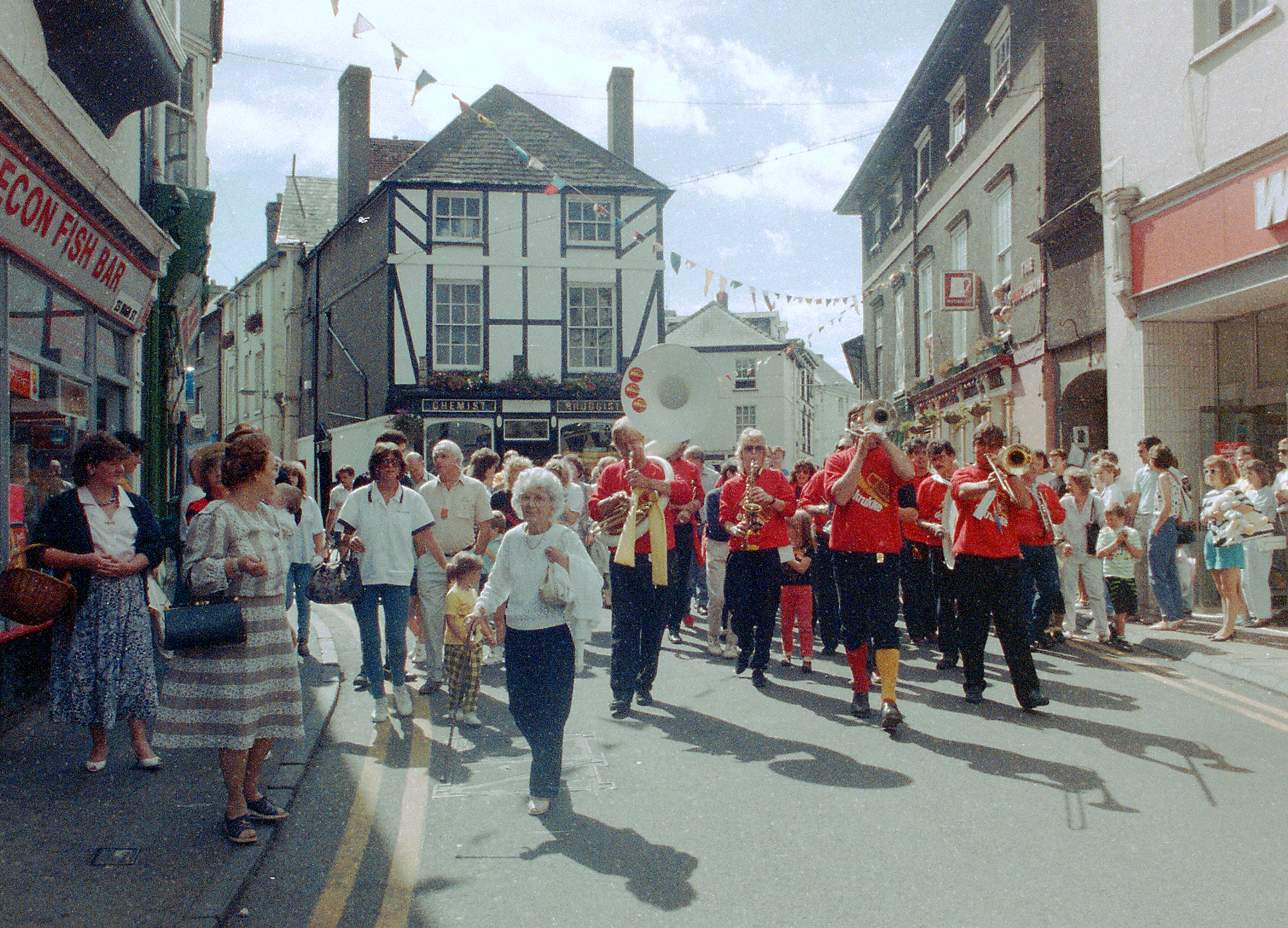 Image of Brass Band parading Brecon dressed in matching red t-shirts