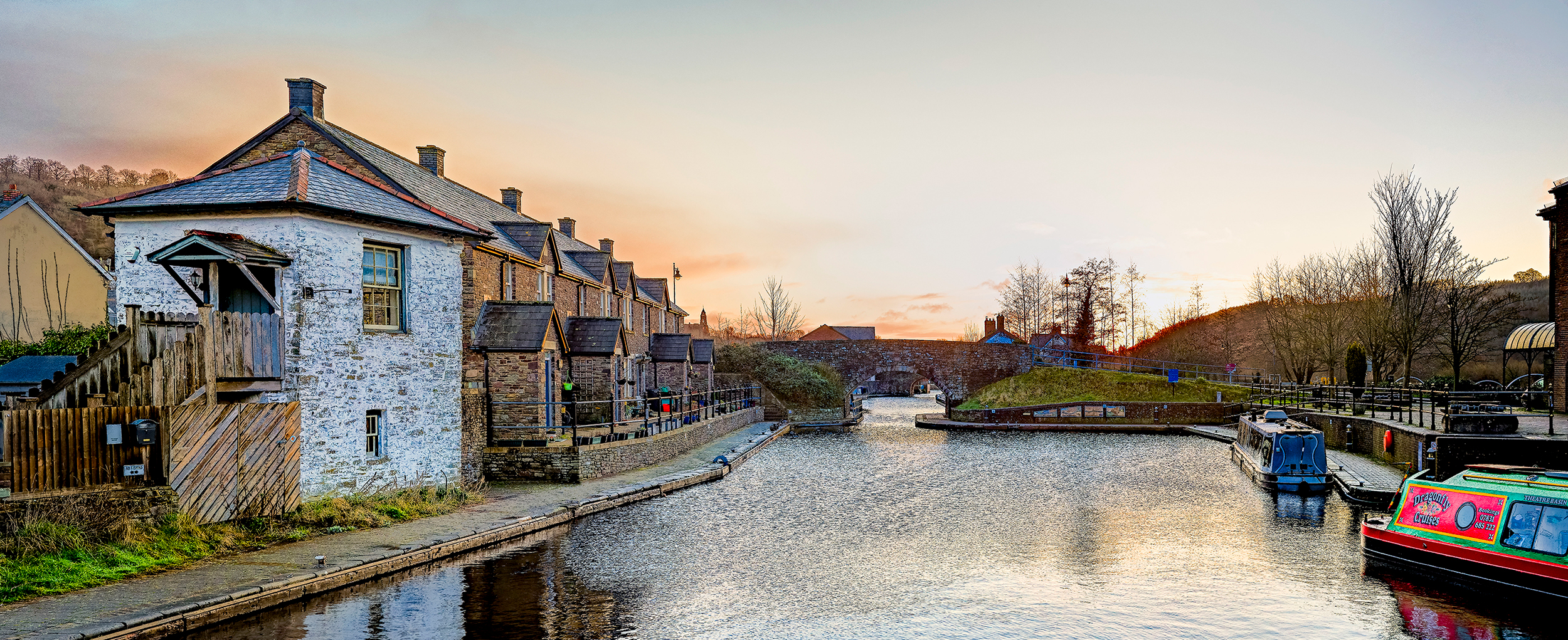 Image of Brecon canal and a row of welsh cottages to the left hand side